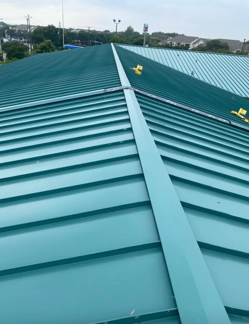 Green commercial metal roof ridge and valley for Metal Roof Repair in Cascades